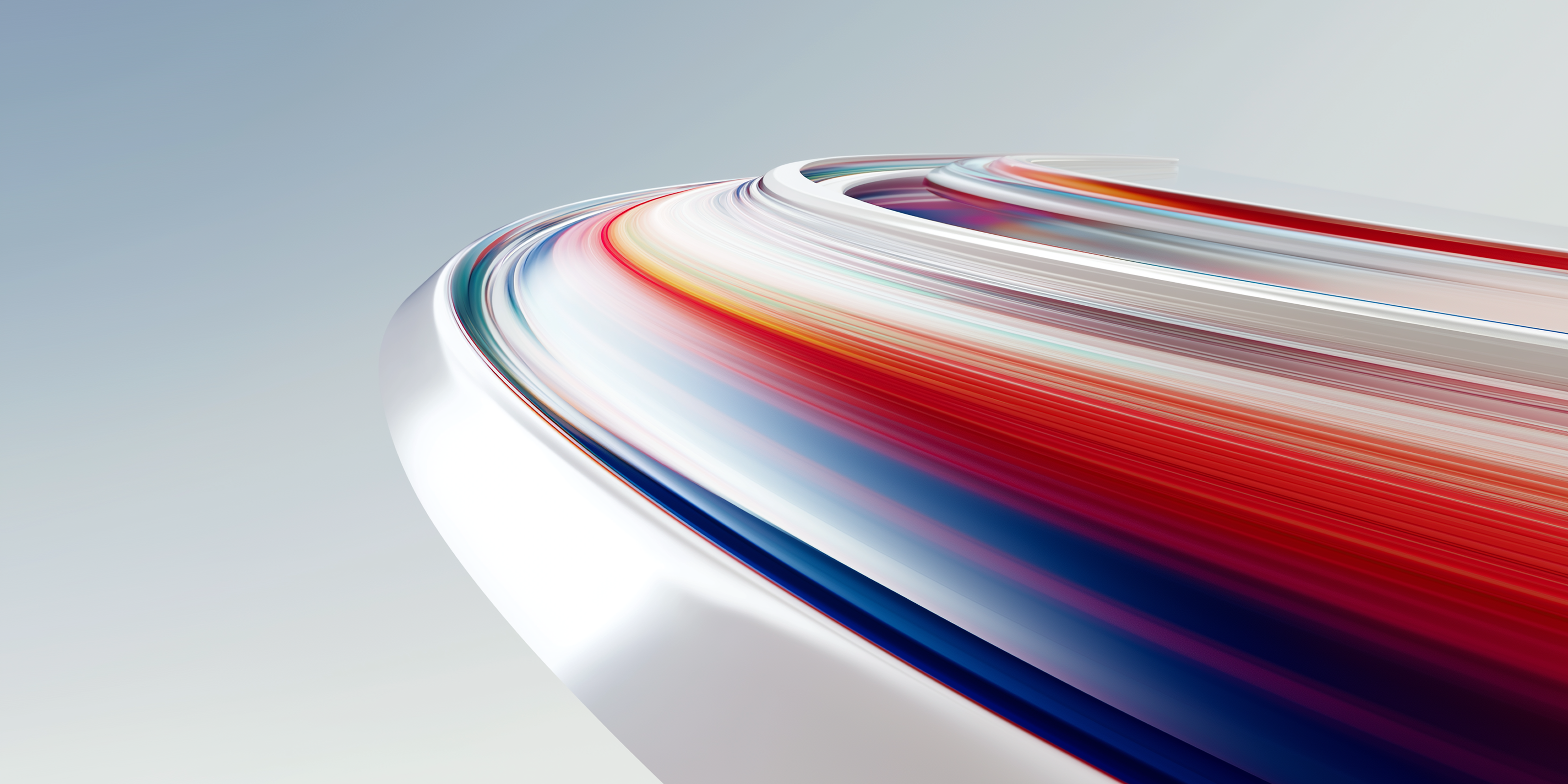 Abstract flowing ribbon design with red, orange, and blue gradients forming smooth, curved motion lines on a light background.